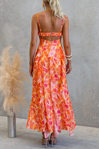 Vestido maxi tipo cami con espalda descubierta, recortes, estampado floral, volante y abertura lateral