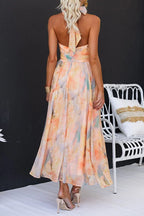 Vestido maxi con escote halter y espalda descubierta, cintura entallada, estampado en acuarela
