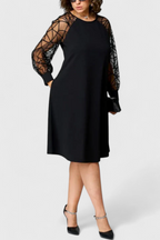 Bellezza Vestido Negro con Mangas de Malla y Corte Holgado
